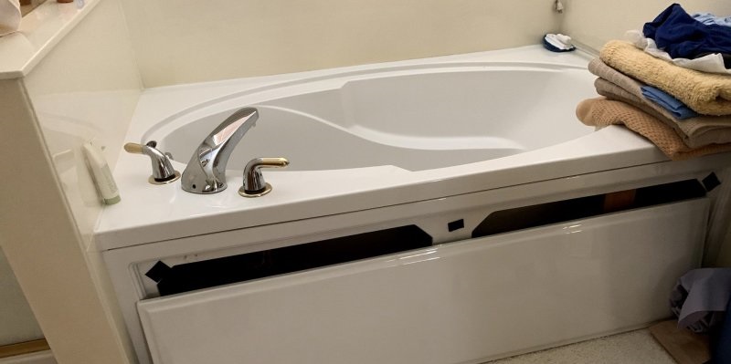 what is a fiberglass tub front panel